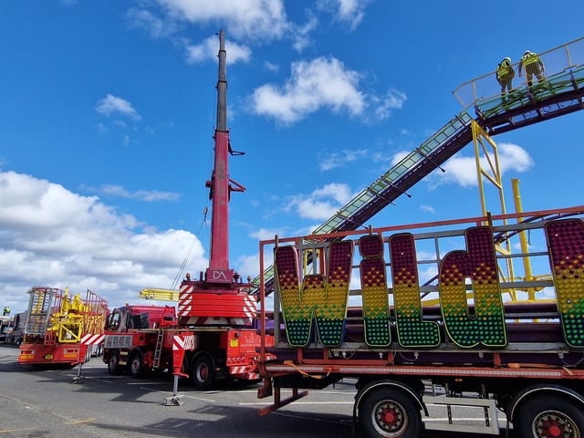 A crane was used to help hoist the steel framework for this rollercoaster ride