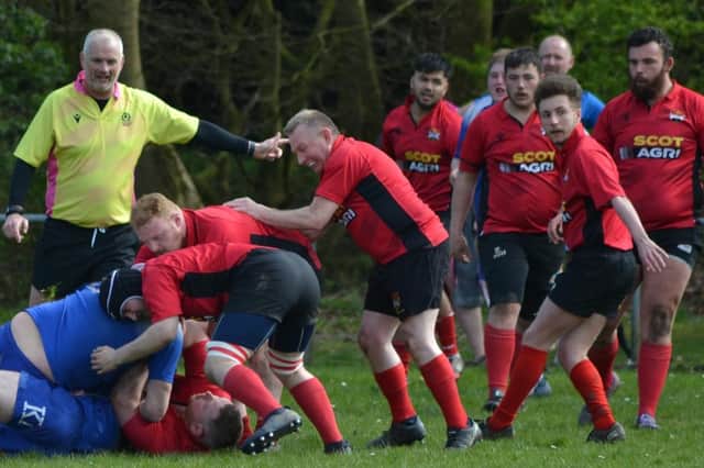 Veteran Glenrothes scrum half Scott Cairns looks to retrieve ball from ruck against Dunfermline 2nd XV, with debutant Aiden Beattie close by