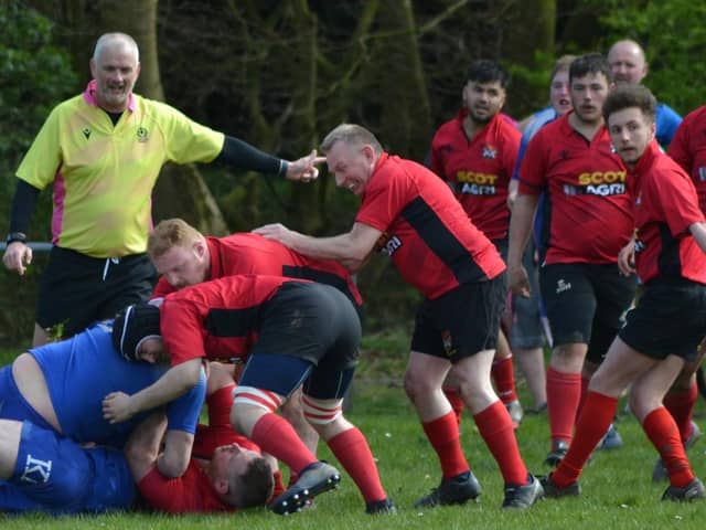 Veteran Glenrothes scrum half Scott Cairns looks to retrieve ball from ruck against Dunfermline 2nd XV, with debutant Aiden Beattie close by
