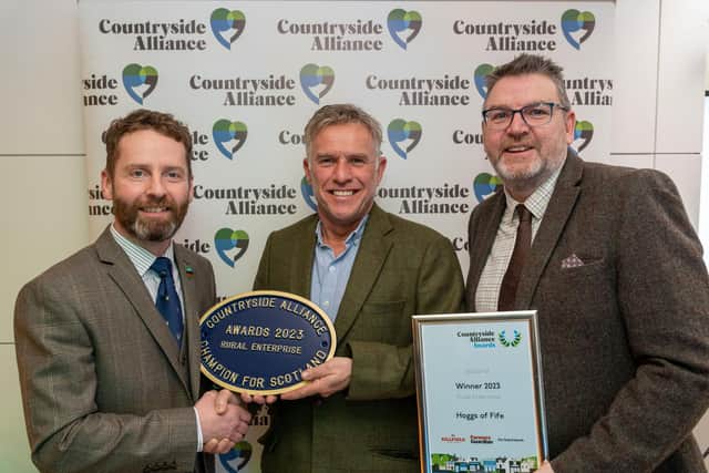 Steve Jepsom and Scott Taylor from Hoggs collect their award plaque at the Scottish Countryside Alliance awards