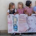 Pupils from Flora Stevenson Primary School in Edinburgh with the design for the bank's new £50 note which features an illustration of Scottish education pioneer Flora Stevenson (Photo: Royal Bank of Scotland/PA Wire).
