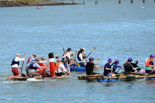 The teams take to the water for the raft race.