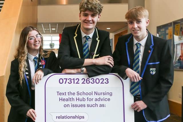 Katie Bell, Niall Jowitt and Aaron Boyack,  pupils at Auchmuty High School, help to launch the service