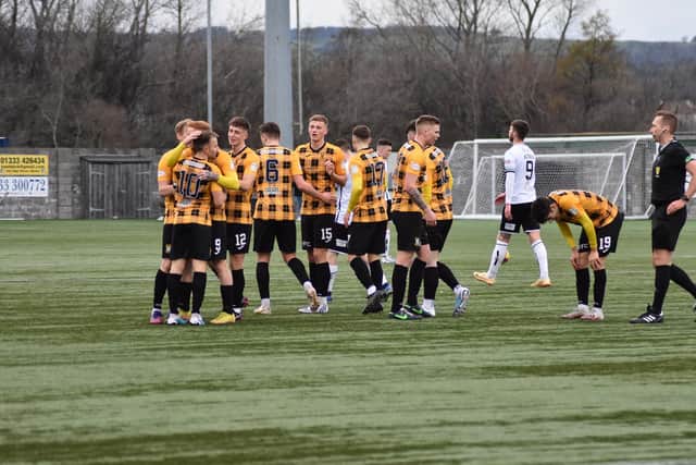 Alan Trouten is mobbed by his East Fife team-mates after heading home a late winning goal against Forfar Athletic (Pics by Kenny Mackay)