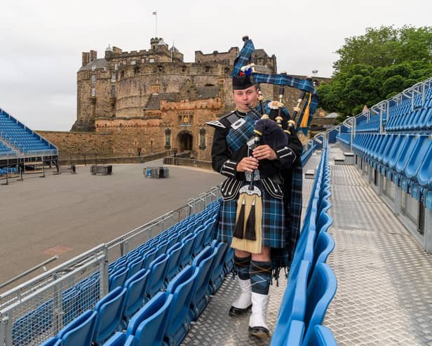 Conner Pratt plays the first pipes to mark the completion of the stand build on Edinburgh Castle Esplanade. (Photo: Ian Georgeson)