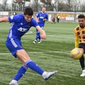 Cove clear their lines under pressure from Fife forward Nathan Austin. Pic by Kenny Mackay