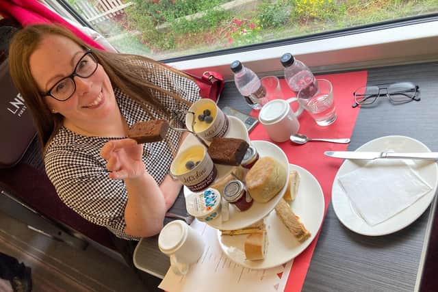 Pam Aldred prepares to enjoy LNER's luxury afternoon tea as the country whizzes by at 125mph