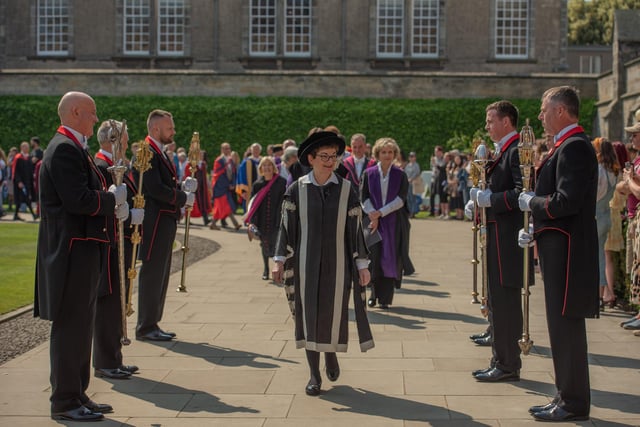 University Principal and Vice-Chancellor Professor Dame Sally Mapstone led the procession of new graduates into St Salvator's Quad. She is flanked by the University's mace bearers.