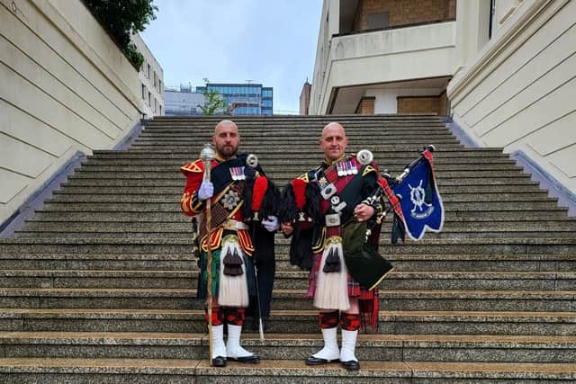 Drum major Peter Muir with twin brother and pipe major James Muir.  The brothers serve with 3 SCOTS.