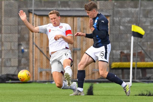 Hearts' Christophe Berra in action against Raith's Kevin Nisbet during a Betfred Cup group match in July 2018 (Photo: Paul Devlin/SNS Group)