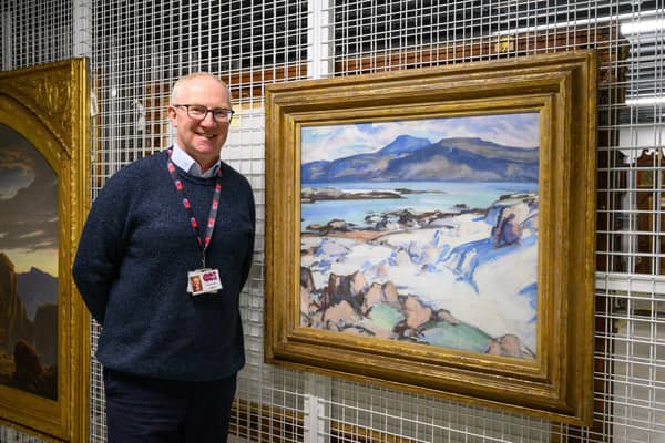 Gavin Grant at the Collections Centre, standing beside his favourite painting in the Fife Collection, Samuel Peploe’s Ben More from Iona.   (Pic: OnFife)