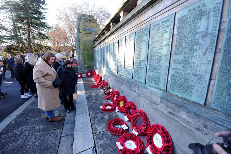 After the service, many people took time to pause at view the poppies placed at the war memorial