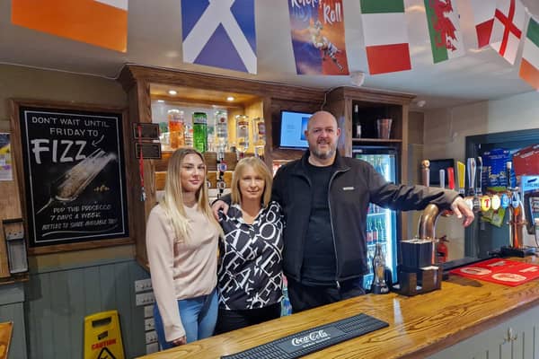 Behind the bar at the Fife Arms are (from left) Joely McPherson, Mandy Chalmers and Derek Holmes (Pic: Fife Free Press)