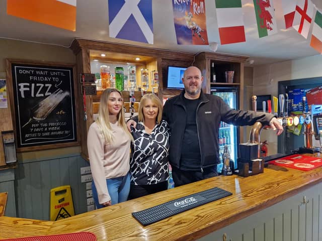 Behind the bar at the Fife Arms are (from left) Joely McPherson, Mandy Chalmers and Derek Holmes (Pic: Fife Free Press)