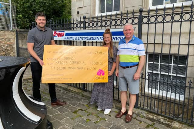 Adam Kent (Maggie’s) is presented with a cheque from Hannah Foster of Briggs Marine along with her dad Dave Foster, who is also one of the event organisers.