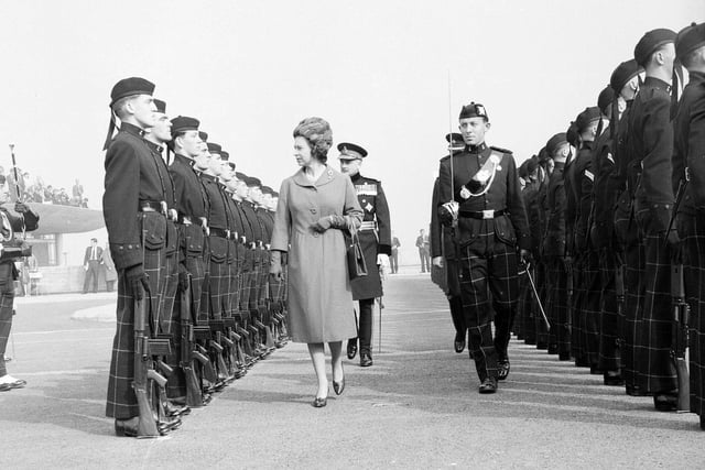 Queen Elizabeth II inspects her guard of honour in Fife,  when she officially opens the Forth Road bridge in September 1964. 