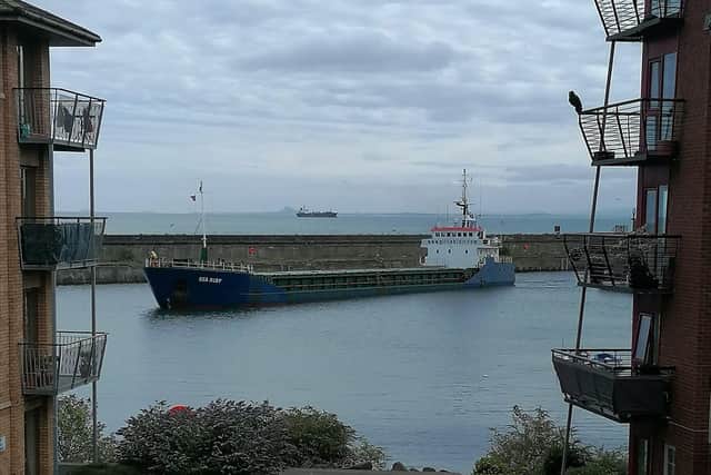 A boat laden with grain sails into Kirkcaldy Harbour to unload at Carr's Flour Mill