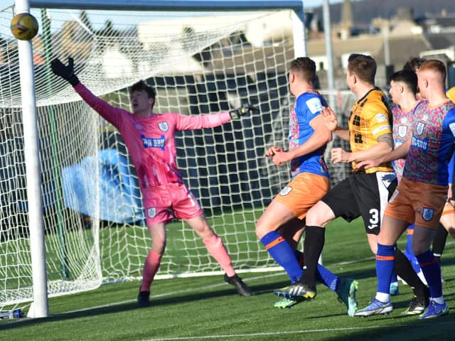 Calum Ferrie's goal comes under pressure from the Fifers