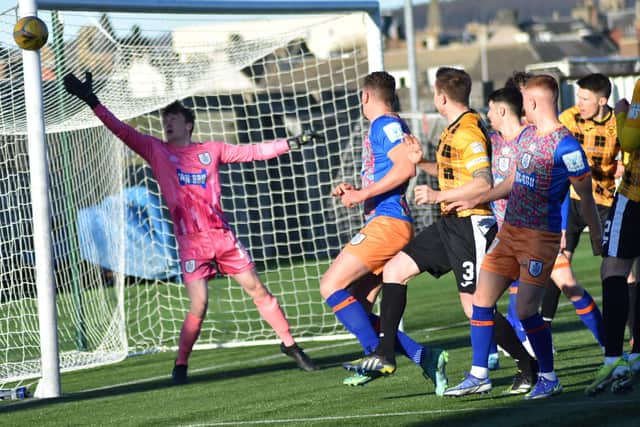 Calum Ferrie's goal comes under pressure from the Fifers