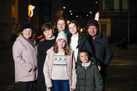 Lesley Reid, pictured with husband John and family, when the Kinghorn lights were switched on last year. Pic: Scott Louden.
