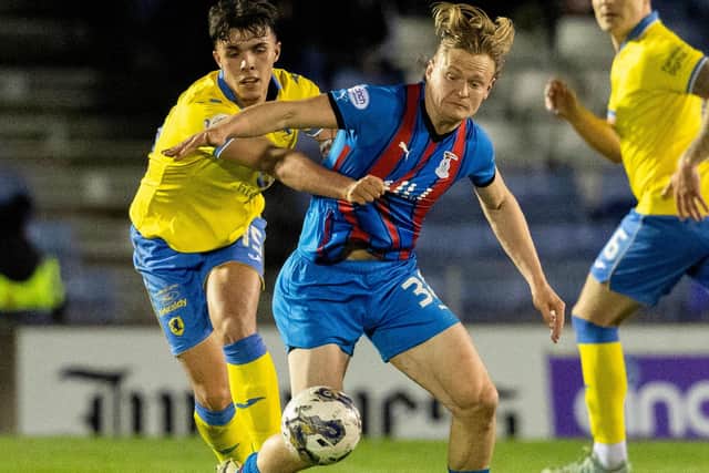 Inverness Caledonian Thistle's Alex Samuel being tackled by Raith Rovers' Dylan Corr at the former's Caledonian Stadium home ground on Friday (Photo by Mark Scates/SNS Group)