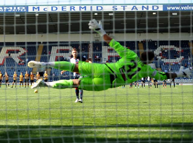 Lewis Vaughan scores the final penalty to secure Raith's bonus point (Pics: Fife Photo Agency)