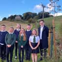 Back, from left, pupils Noah Carter, Emily Inglis and Blair Hill. Front: Jessica Couser, Abigail Cunningham and Kayla Scobie. They are with with Tom Antram, communications consultant at FEP.