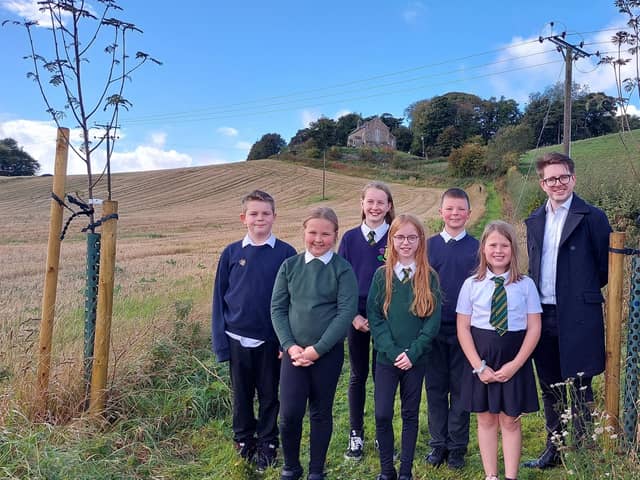 Back, from left, pupils Noah Carter, Emily Inglis and Blair Hill. Front: Jessica Couser, Abigail Cunningham and Kayla Scobie. They are with with Tom Antram, communications consultant at FEP.