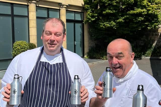 Resort head chef Stuart Fraser and executive chef Martin Hollis with the new refillable bottles.