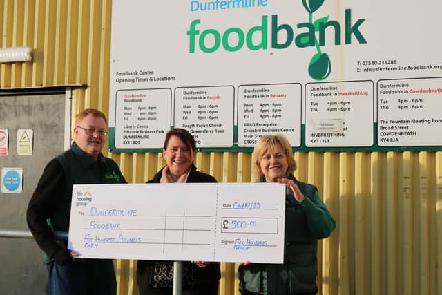 Fife Housing's Helen Miller (centre) presents John Thompson, Administrator and Sandra Beveridge, Project Manager of the Dunfermline Foodbank with their donation (Pic: Submitted)