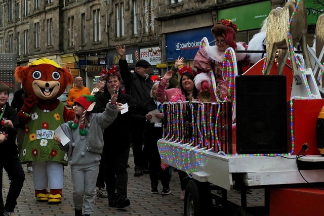 Representatives from the charity Nourish took part in a parade behind Santa's sleigh.
