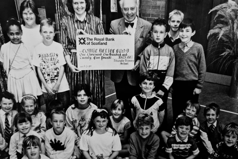 A Comic Relief fundraiser from 1989 featuring pupils from an un-named Glenrothes primary school with teacher Mrs McFarlane, and Councillor Jim Lewis