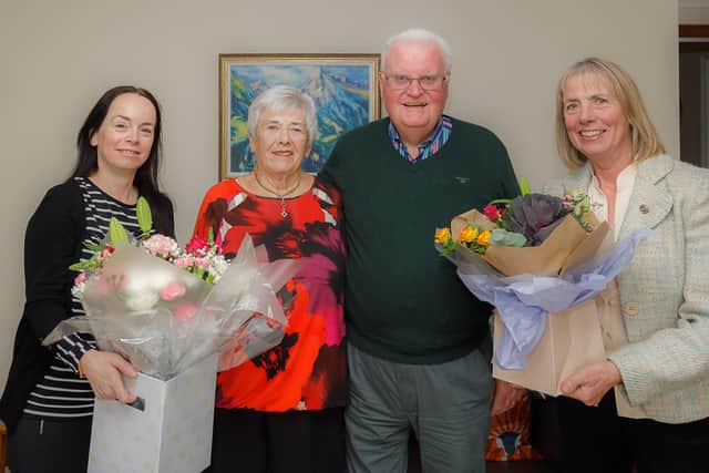 Charlie and Sheila Oliver were presented with flowers by Councillor Kathleen Leslie and Deputy Lieutenant Clare Mitchell (Pic: Andrew Beveridge)