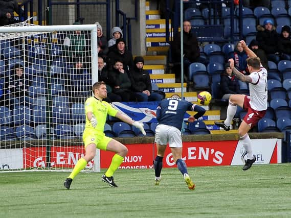 With Raith's Jamie Gullan challenging Arbroath keeper Derek Gaston, the ball is about to go in for 1-0 (Pic Fife Photo Agency)