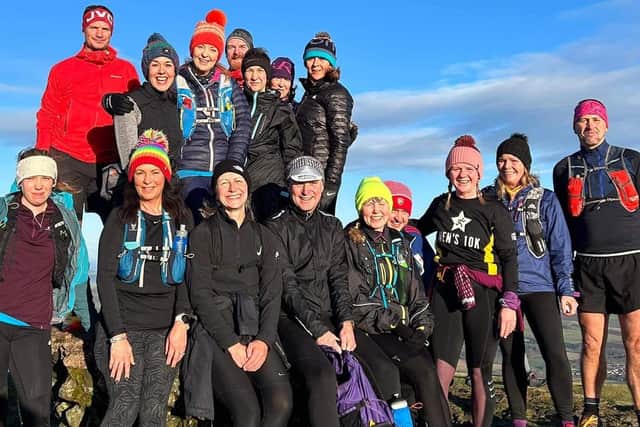 A group of Kirkcaldy Wizards at the summit of West Lomond during the Saturday morning Roaming in the Lomonds social run