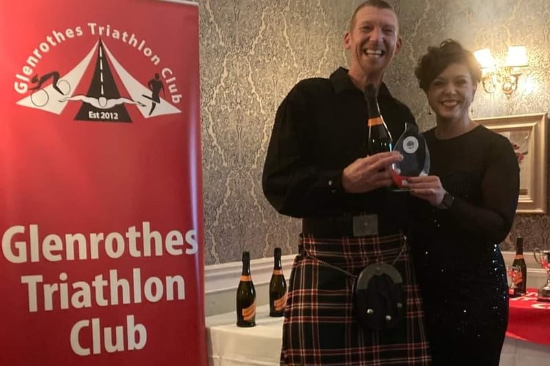 Alan Robb got his Glenrothes Tri Club Most Improved Male award from Lindsay Arnott