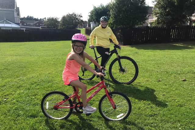 Cally Jenkins on her trusty bike Rosie with Gillian Stewart.