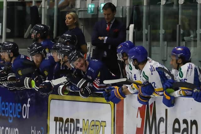 Dundee Stars' Johnny Walker and Fife Flyers' Fynn Page have words on the bench (Pic: Derek Black)