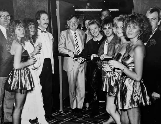 The December 1985 opening of Oasis nightclub in Glenrothes. Pictured doing the honours is businessman, Eddie Melville, who had a string of clubs and pubs across Fife and central Scotland. To his right is the familiar face of Colin Routh from chart toppers, Black Lace. The picture first appeared in the Glenrothes Gazette.
