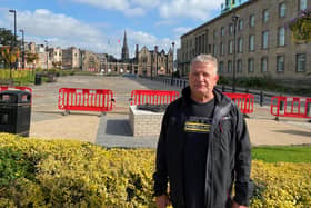 David Torrance MSP with the charred remains of Kitty's in the background (Pic: Submitted)