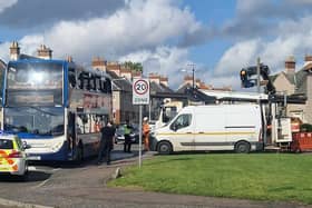 Police at the scene of the collision which involved a bus and a truck carrying logs (Pic: Fife Jammer Locations)
