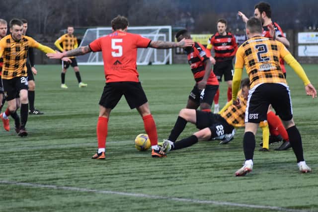 The Clyde defence scramble to clear from the Methil men