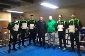 MSP David Torrance (centre) presented six Kingdom boxers with their certificates. Also pictured is club head coach Mike Keane. (Submitted pic)