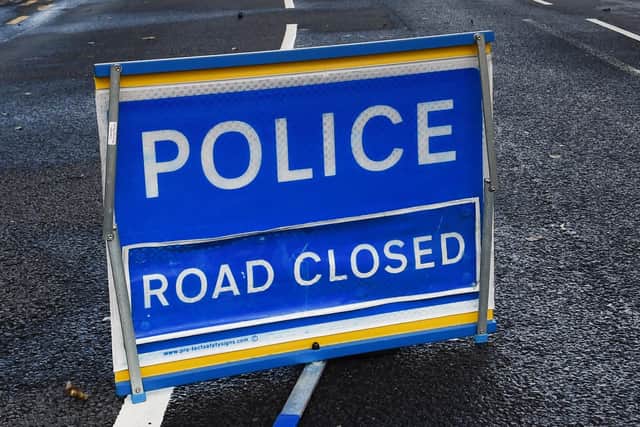 The road was closed for several hours following the crash incolving a car and a bike.