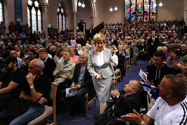 Nicola Sturgeon enters a packed St Bryce Kirk in Kirkcaldy - ironically, where Gordon Brown's father was once minister -  and gives the thumbs up to supporters.
She was one of a several high profile figures who came to the venue during the independence campaign, and drew, by farm the biggest audience.