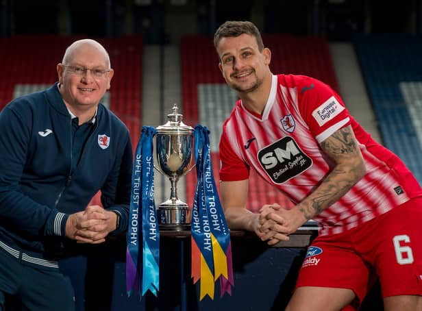 John McGlynn and Kyle Benedictus with the  SPFL Trust Trophy (Pic: © Craig Watson)