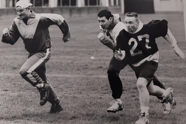 In training at (from left) Gary Newman, Ian Christie (wide receiver), and Jimmy Brannen (defensive back)