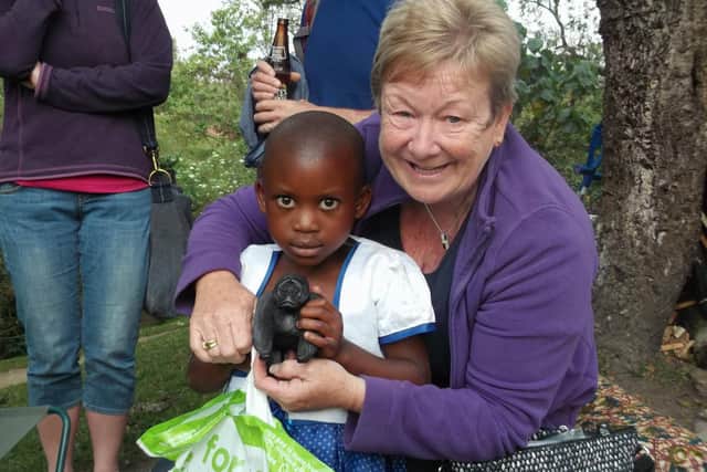 Kirkcaldy fundraising champ Janice Allan with Constance, a girl from Uganda who she sponsors