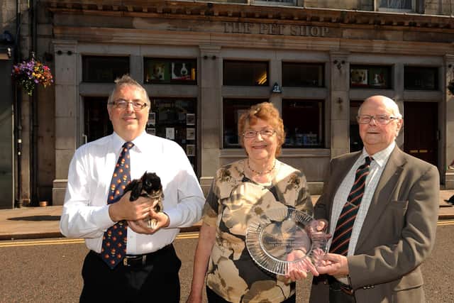Happier times: Pet Shop owners celebrate 60 years in business - Ken, Helen and David Galloway (Pic: Fife Photo Agency)