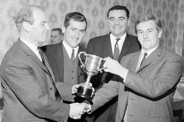 Renton Laidlaw (left) presents a trophy during his spell as the Edinburgh Evening News golf writer